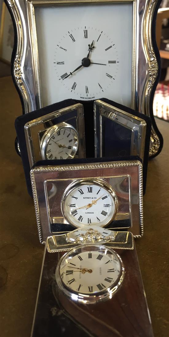 4 silver framed clocks